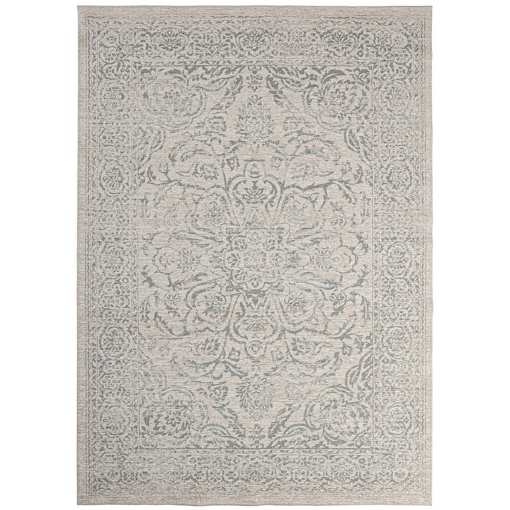 Tappeto stile orientale beige con dettagli floreali in rilievo, effetto vintage e finitura elegante.